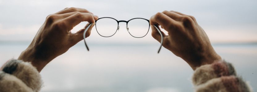 Personal Vision Statement represented by a person holding glasses