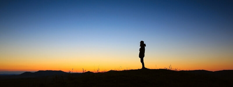 man watching sunset symbolizing how to stop negative self talk